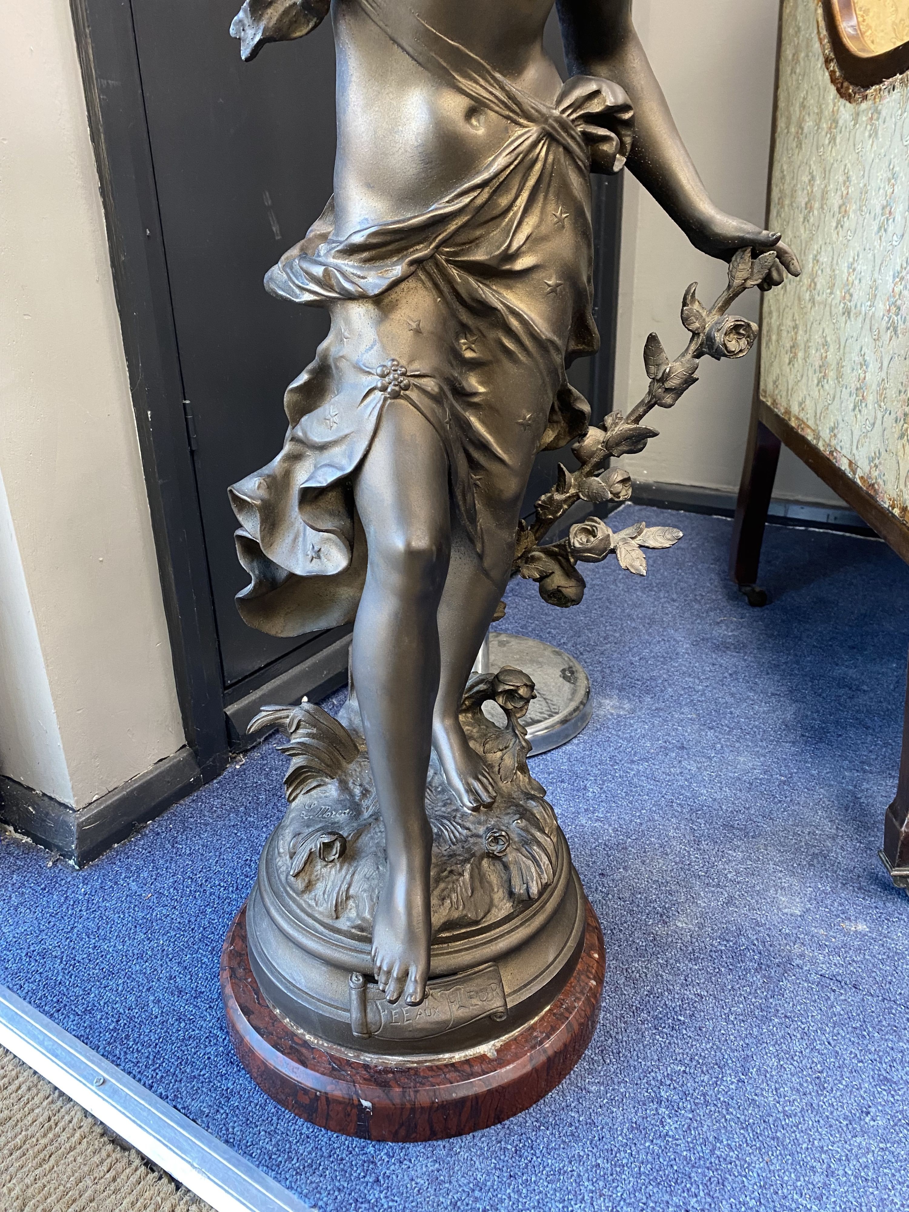 A 'Fee Aux Fleurs' cast bronze spelter fairy statue on marble base, height 90cm